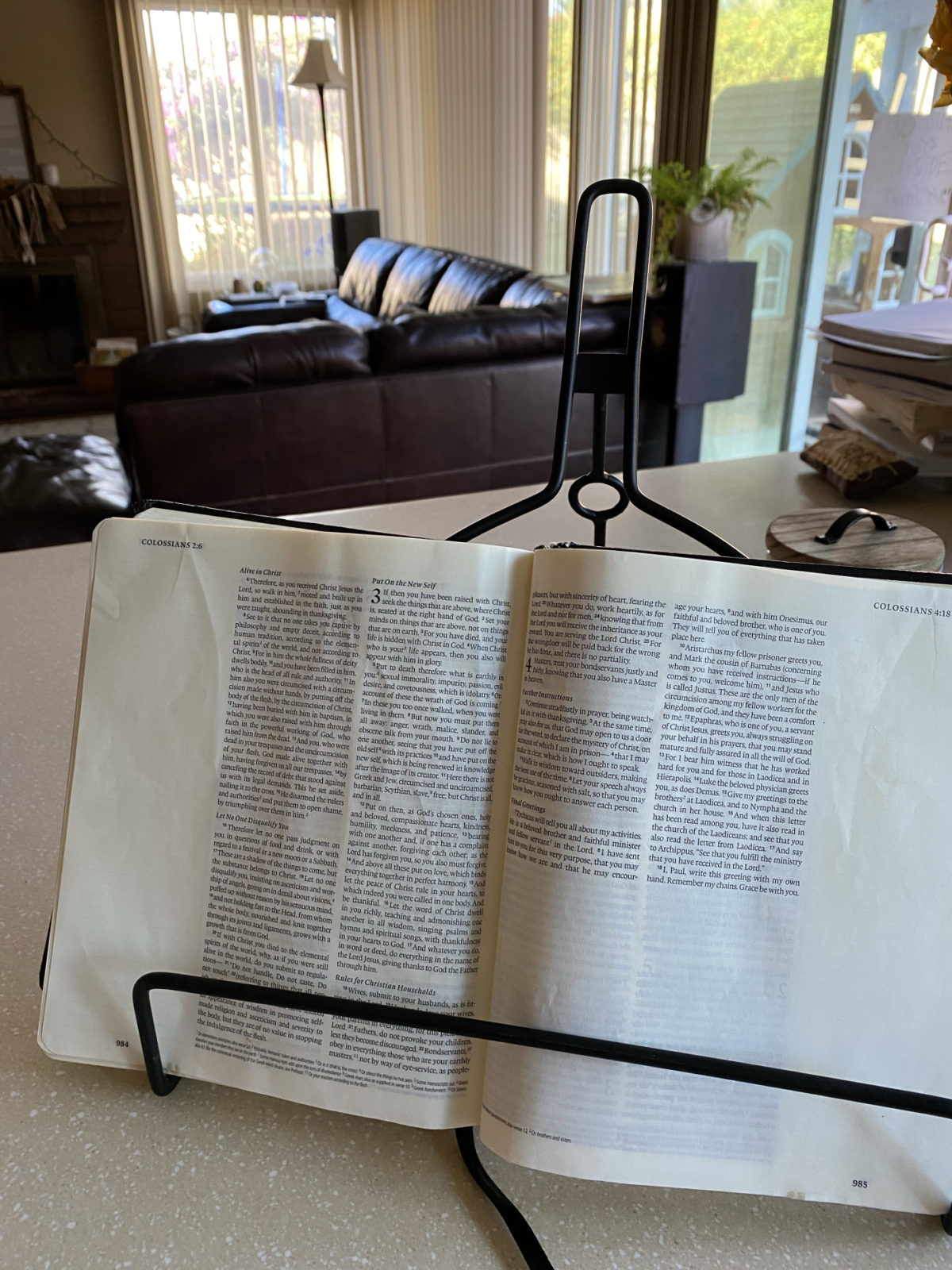 Bible open on counter, with living room in the background